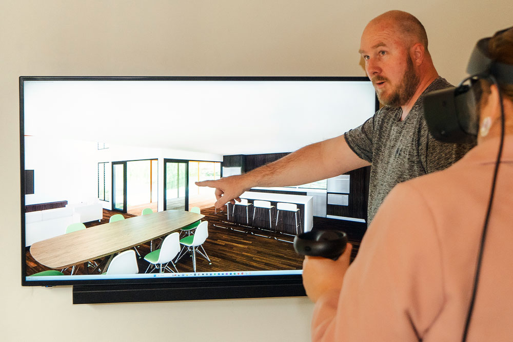 Nathan demonstrating new design via VR headset and monitor