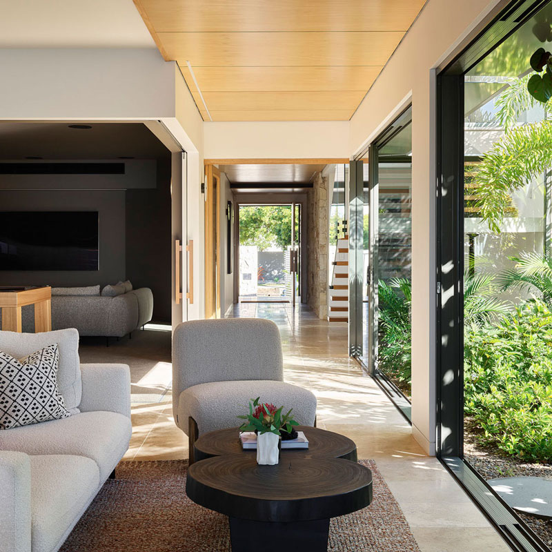 Interior view of lounge room opening to garden